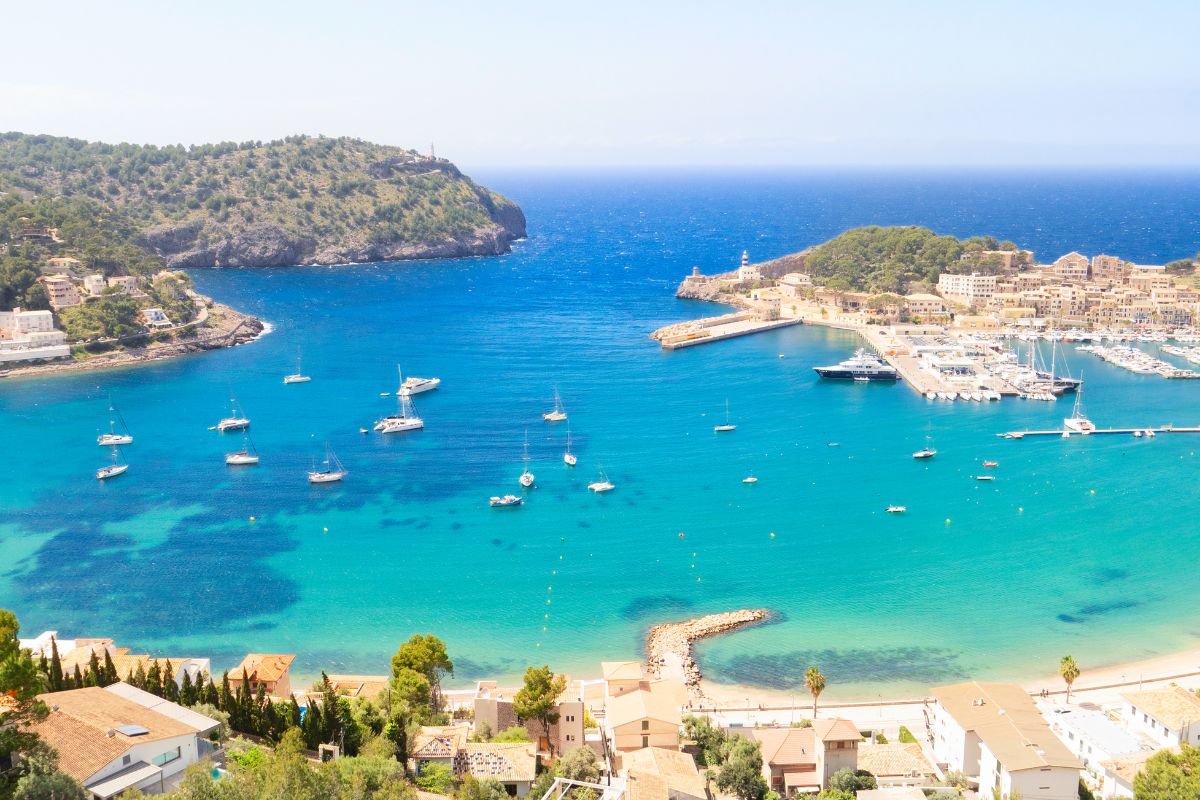 Panoramic view of Port de Sóller in Mallorca with luxury yachts anchored in the bay